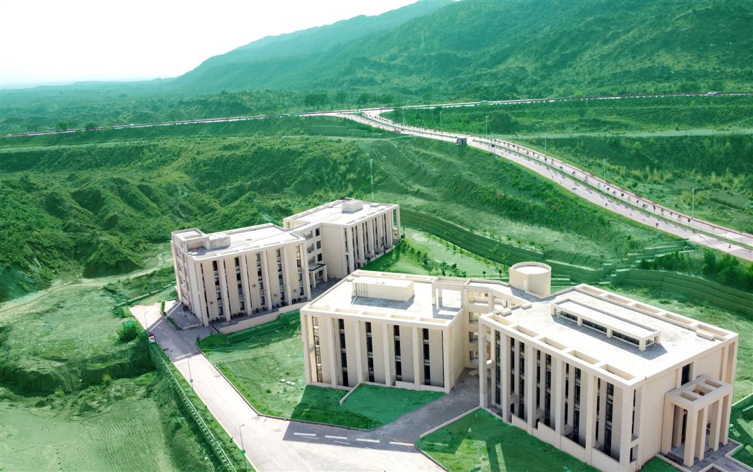 Aerial view of the Al-Qadir University campus amid the Sohawa hills