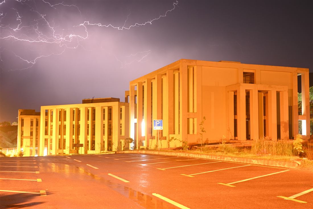 Al-Qadir University campus illuminated at night